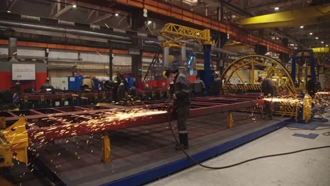 Factory workers in protective uniform and safety masks use metalworking Stock Footage 202048955