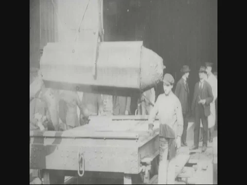 Factory workers putting block for steelwork - 1918 Stock Footage 83657535