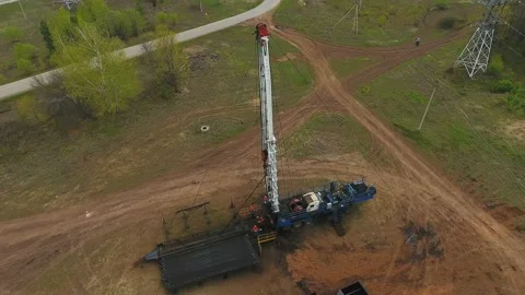 Factory Workers Settle Oil Well Mechanism in Field Stock Footage 88390176