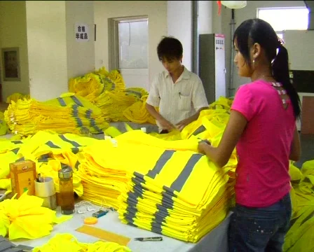 Factory workers sewing jackets Stock Footage 277919