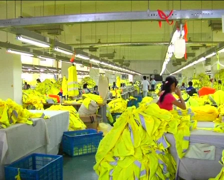 Factory workers sewing jackets Stock Footage 278436