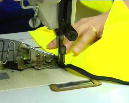 Factory workers sewing jackets Stock Footage 279004