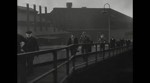 Factory workers on their way to work at steel mill Stock Footage 44571017