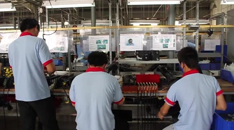 Factory Workers on Vietnam Assembly Line Stock Footage 44418677