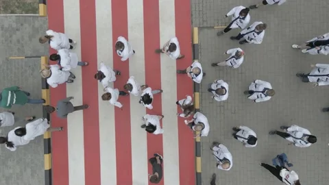 Factory workers walking through a pedestrian crossing. Stock Footage 219470598