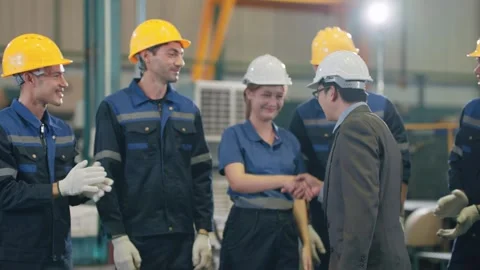 Factory workers wear hard hats and gloves Stock Footage 341925427