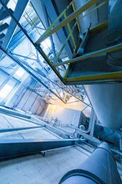 Factory workshop interior and machines on glass production background Foto stock