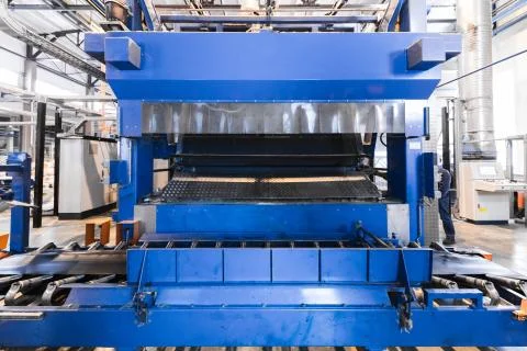 Factory workshop interior and machines on glass production background Foto stock