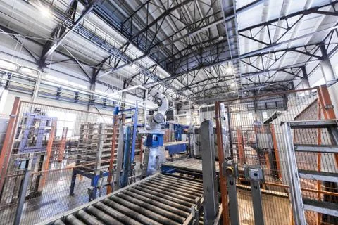 Factory workshop interior and machines on glass production background Foto stock