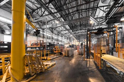 Factory workshop interior and machines on glass production background Foto stock