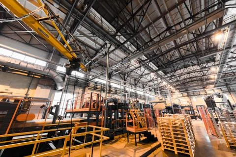 Factory workshop interior and machines on glass production background Foto stock