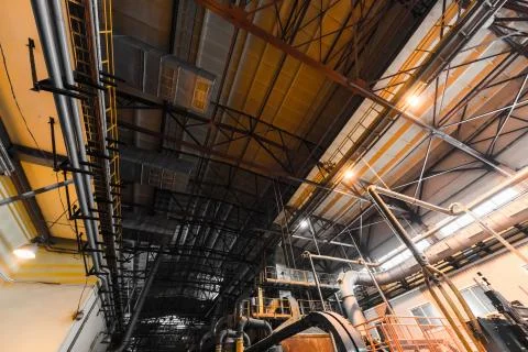 Factory workshop interior and machines on glass production background Foto stock