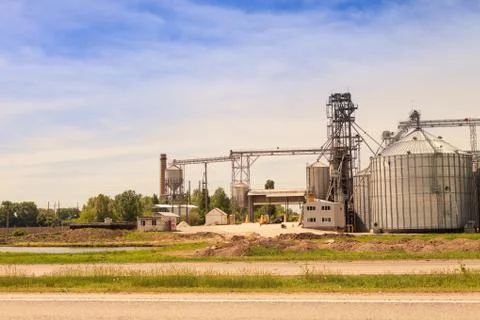 Factory yard metal tank of modern silo in countryside 写真素材