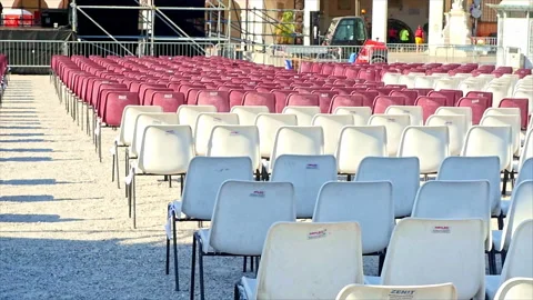 Fade out of some benches placed on a square for an event. Stock Footage 162095607
