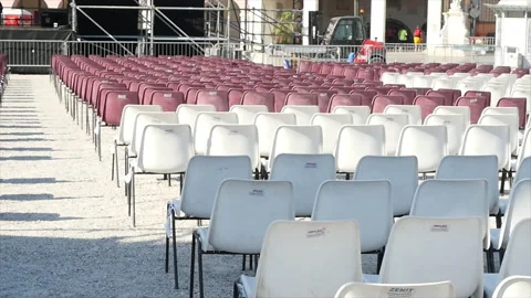 Fade out of some benches placed on a square for an event. Stock Footage 162095759