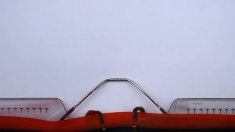 Fade in - phrase printed on an old typewriter in red letters, close up. Stock Footage 126777005