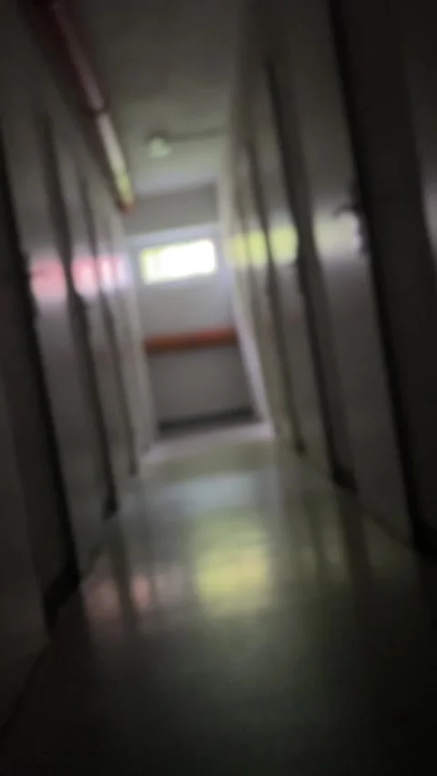 Faded hallway scene. Soft reflections fade through distant glass panes Stock Footage 335354976