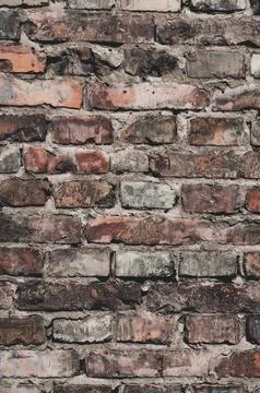 Faded old red brick wall, wide rough vintage panoramic texture. Dirty wall wi Stock Photos