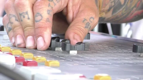 Faders on audio board self-adjust as tech makes adjustment Stock Footage 57402827