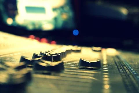 Faders on a large mixing board in a studio Stock Photos