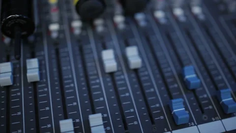 Faders remote sound engineering. Mixer control of the sound engineer standing on Stock Footage 129704254