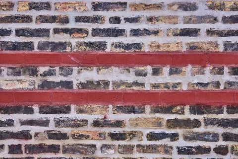Fading brick wall background asset with two horizontal red brick lines cutting 스톡 사진