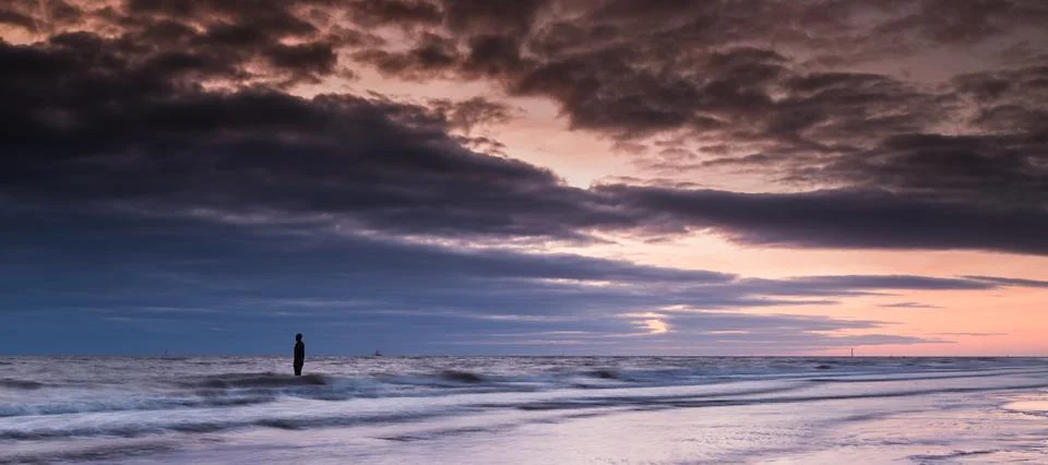 Fading light on Crosby beach Stock Photos