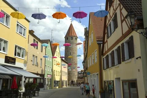 Faerberturm also called Pulverturm coloured umbrellas in the sky Gunzenhausen Stock Photos