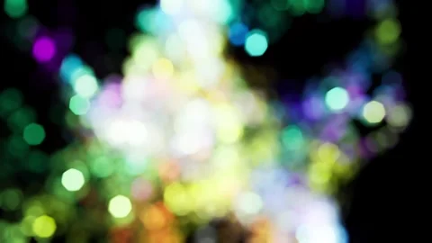Faerie of particles. Multicolored light rainbow highlights in the dark. Stock Footage 306940346