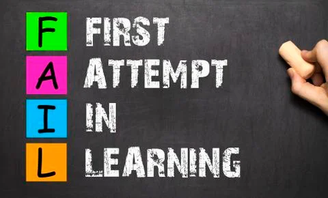 FAIL acronym First Attempt In Learning handwritten with  chalk on blackboard. Stock Photos