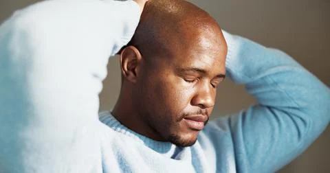 Fail, mistake and regret with black man in home for reaction to bad news, loss 스톡 사진