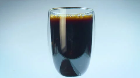 Fail on studio shooting coffee drink, while injecting milk with a syringe. Close Stock Footage 162408547
