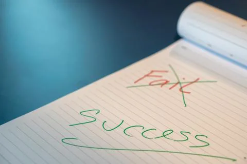 Fail text with a hand with a red pen And crossed out with a green pen on the  Stock Photos