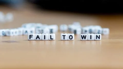 Fail to win slogan in white block bead letters. Motivation inspiration cheer up Stock Photos