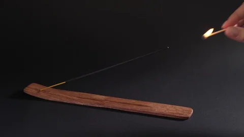 Failed attempt to light an incense stick. Oriental aromatherapy, a subject for 库存影片 124714177