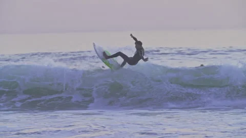 Failed attempt to surf jump the wave by a surfer and fall from the surfboard Stock Footage 239452178