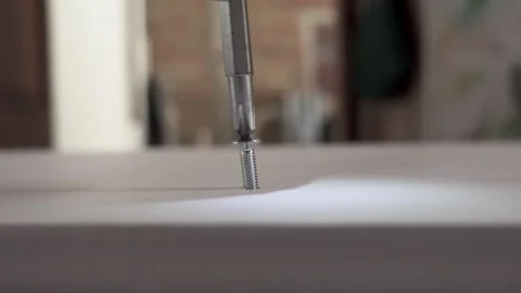 Failed installation of a self-tapping screw into plywood Stock Footage 326063835