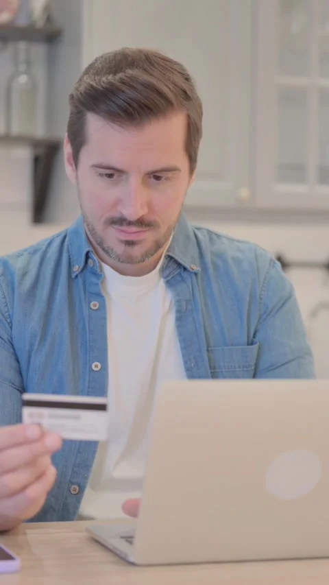 Failed Online Shopping by Young Man on Laptop, vertical video 스톡 동영상 328565744