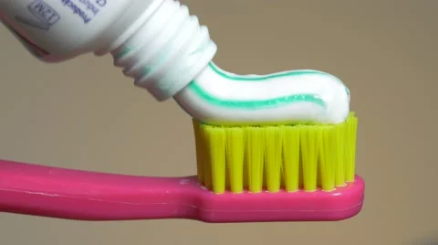Failed putting toothpaste on toothbrush Stock Footage 60806786