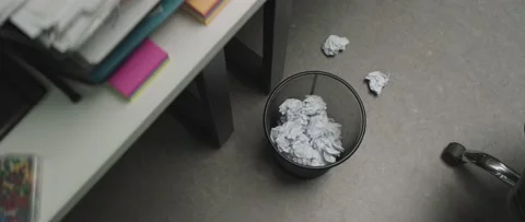Failing to throw crumpled papers in to the recycle bin. Trash bin full of paper Stock Footage 199038104