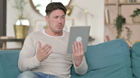 Failure for Middle Aged Man on Tablet, at Home Video stock 142382810