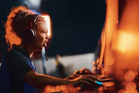 Failure. Side view of angry mixed race girl, female cybersport gamer wearing Stock Photos