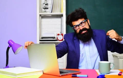 Failure at work. Enraged office worker having problems with technology. Angry Stock Photos