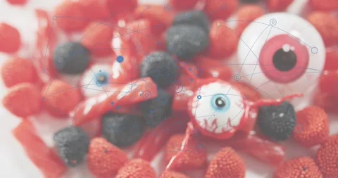 Faint blue nodes appearing over candy cluster, forming network, dissolving to Stock Footage 316963533