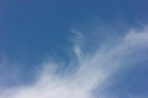 Faint clouds on the blue sky Stock Photos
