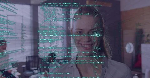 Faint green code streams rising and passing across face, woman standing in Stock Photos