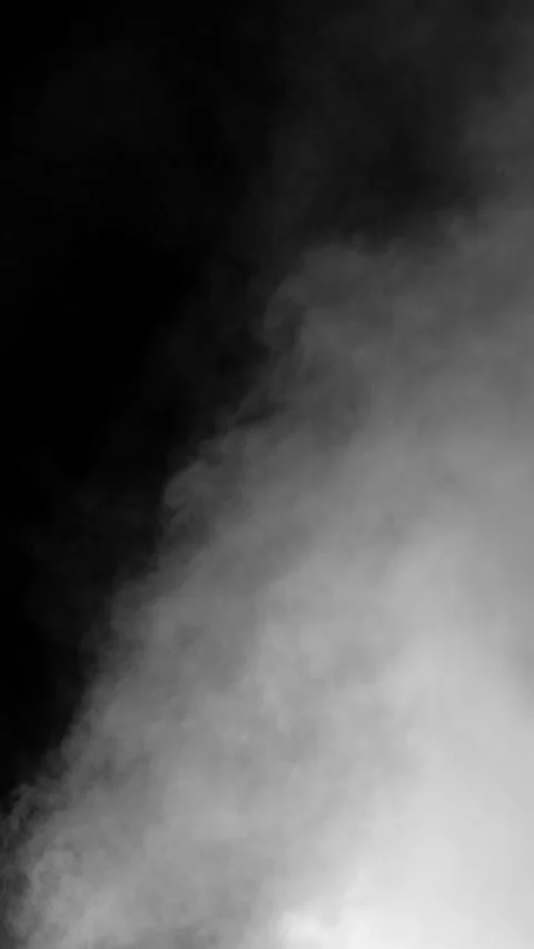 Faint puff of smoke enters frame on black background, vertical format Stock Footage 340145462