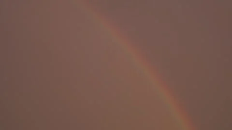 Faint Rainbow Appears Against a Dusky Sky Stock-Footage 336961194