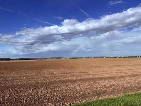 Faint Rainbow Over The Field Foto stock