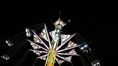 Fair Attraction - Flying Chain Wheel Ride - Night Time - 01 Stock Footage 54637149